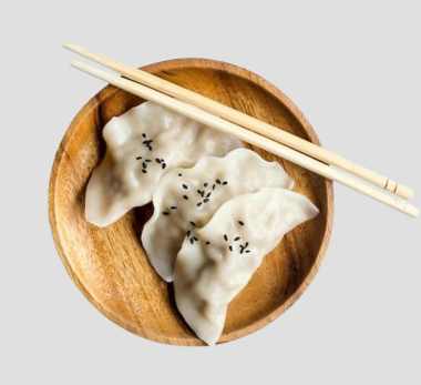 two dumplings in a wooden plate